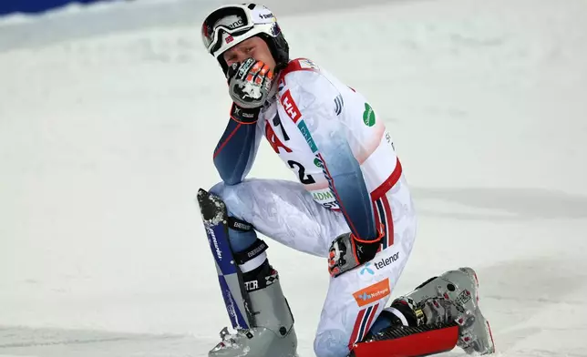 Norway's Henrik Kristoffersen is overcome by emotion as eh celebrates at the finish area of an alpine ski, men's World Cup slalom, in Schladming, Austria, Wednesday, Jan. 28, 2026. (AP Photo/Marco Trovati)