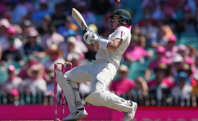 Australia's Steve Smith reacts as he avoids a bouncer during play on day three of the fifth and final Ashes cricket test between England and Australia in Sydney, Tuesday, Jan. 6, 2026. (AP Photo/Mark Baker)