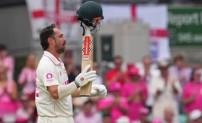 Australia's Travis Head celebrates after scoring a century during play on day three of the fifth and final Ashes cricket test between England and Australia in Sydney, Tuesday, Jan. 6, 2026. (AP Photo/Mark Baker)