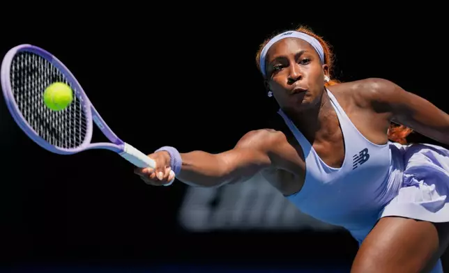 Coco Gauff of the U.S. plays a forehand return to Kamilla Rakhimova of Uzbekistan during their first round match at the Australian Open tennis championship in Melbourne, Australia, Monday, Jan. 19, 2026. (AP Photo/Aaron Favila)