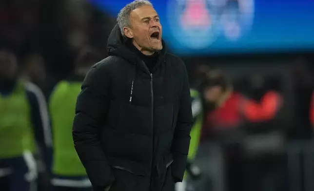 PSG's head coach Luis Enrique gives instructions during the French Ligue 1 soccer match between Paris Saint-Germain and Paris FC in Paris, Sunday, Jan. 4, 2026. (AP Photo/Christophe Ena)