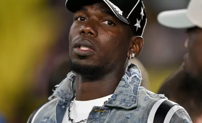 FILE - Monaco's Paul Pogba stands on the touchline as players warm-up before a Champions League opening phase soccer match between Monaco and Tottenham Hotspur in Monaco, Wednesday, Oct. 22, 2025. (AP Photo/Philippe Magoni, file)