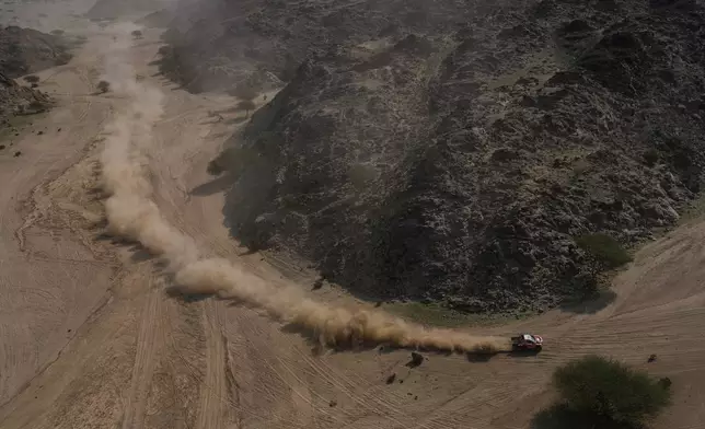 Driver Seth Quintero and co-driver Andrew Short compete during the first stage of the Dakar Rally in Yanbu, Saudi Arabia, Sunday, Jan. 4, 2026. (AP Photo/Thibault Camus)