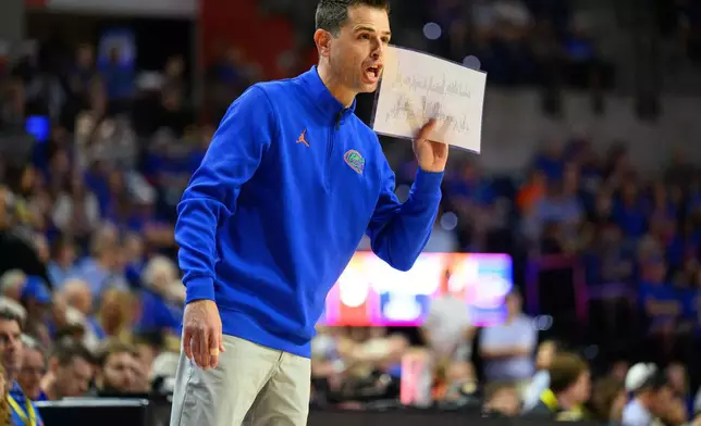 Florida head coach Todd Golden yells during the first half of an NCAA college basketball game against Tennessee, Saturday, Jan. 10, 2026, in Gainesville, Fla. (AP Photo/Noah Lantor)
