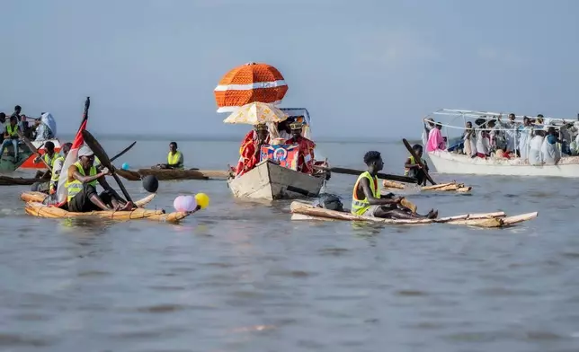 Ethiopian orthodox believers ride boats to celebrate Timket, the Ethiopian Epiphany, on lake Dembel, in Batu, Ethiopia, Sunday, Jan. 18, 2026. (AP Photo/Amanuel Sileshi)