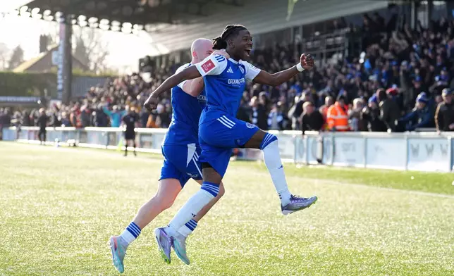 Macclesfield Town's Isaac Buckley-Ricketts celebrates scoring his side's second goal, during the FA Cup third round soccer match between Macclesfield Town and Crystal Palace, at the Leasing.com Stadium, Macclesfield, England, Saturday, Jan. 10, 2026. (Martin Rickett/PA via AP)