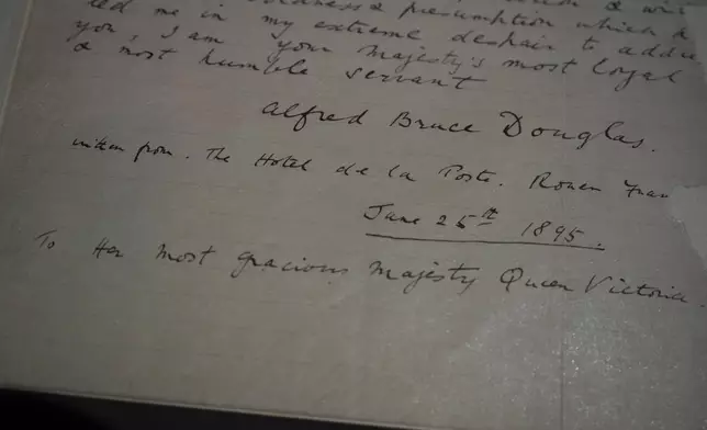 A letter written by Lord Alfred Douglas to Britain's Queen Victoria, petitioning for the release of Oscar Wilde from prison on display during a press preview of an exhibition entitled Love Letters at the National Archives in London, Wednesday, Jan. 21, 2026, Wilde was imprisoned in 1895 for gross indecency. (AP Photo/Alastair Grant)