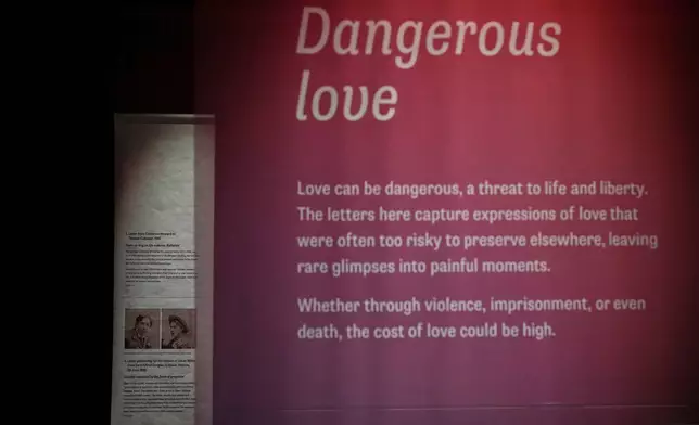 A general view of part of the Love Letters exhibition at the National Archives, with pictures of the writer Oscar Wilde and Lord Alfred Douglas, in London, Wednesday, Jan. 21, 2026. (AP Photo/Alastair Grant)
