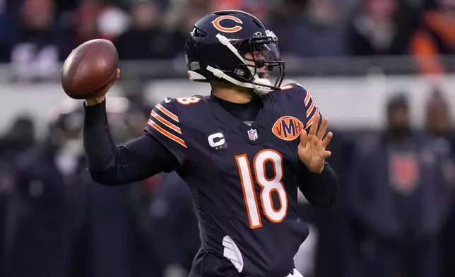 Chicago Bears quarterback Caleb Williams throws a pass during the first half of an NFL football game against the Detroit Lions, Sunday, Jan. 4, 2026, in Chicago. (AP Photo/Erin Hooley)