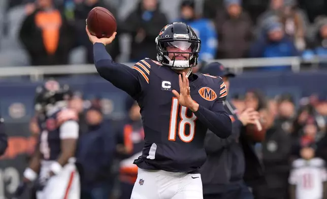 Chicago Bears quarterback Caleb Williams warms up before an NFL football game against the Detroit Lions, Sunday, Jan. 4, 2026, in Chicago. (AP Photo/Nam Y. Huh)