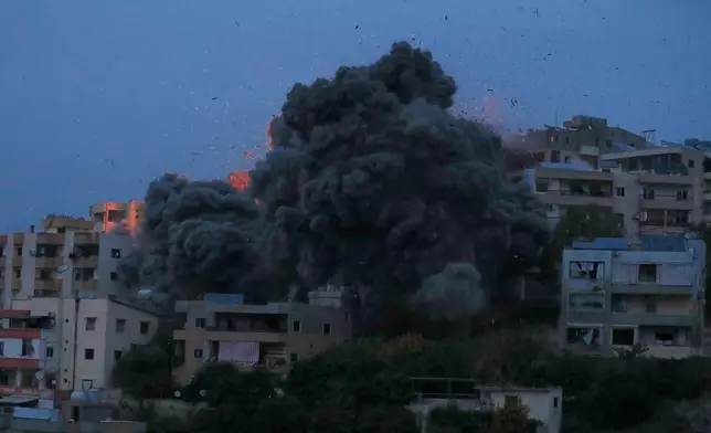Smoke rises from an Israeli airstrike that hit a building in Kharayeb village, south Lebanon, Wednesday, Jan. 21, 2026. (AP Photo/Mohammed Zaatari)