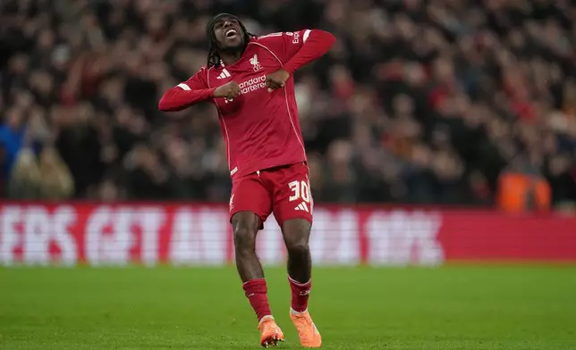Liverpool's Jeremie Frimpong celebrates after scoring during the FA Cup third round soccer match between Liverpool and Barnsley in Liverpool, England, Monday, Jan. 12, 2026. (AP Photo/Jon Super)