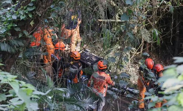 Search and rescue operation continues after a huge mound of garbage collapsed at a waste segregation facility in Binaliw, Cebu city on Friday, Jan. 9, 2026. (AP Photo/Jacqueline Hernandez)