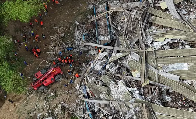 Rescuers continue operations on a collapsed waste segregation facility in Binaliw, Cebu city, central Philippines on Saturday, Jan. 10, 2026. (AP Photo/Jacqueline Hernandez)