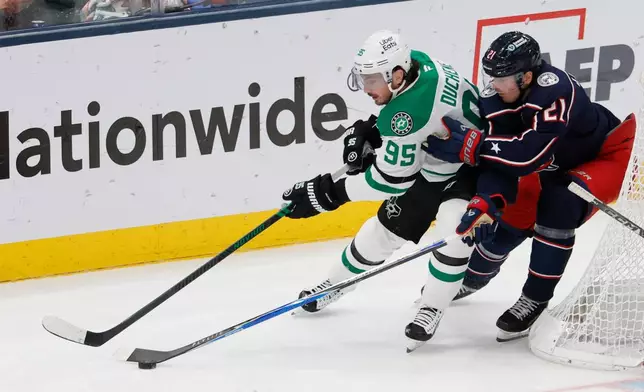 Dallas Stars' Matt Duchene, left, tries to skate past Columbus Blue Jackets' Isac Lundestrom during the third period of an NHL hockey game, Thursday, Jan. 22, 2026, in Columbus, Ohio. (AP Photo/Jay LaPrete)