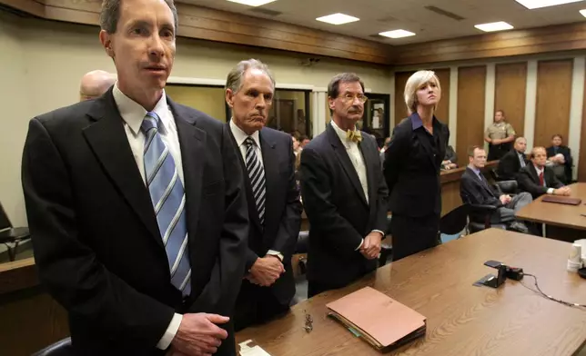 FILE - Warren Jeffs, left, and council react to the verdict against him Tuesday, Sept. 25, 2007, in St. George, Utah. (Jud Burkett/The Spectrum via AP, File)