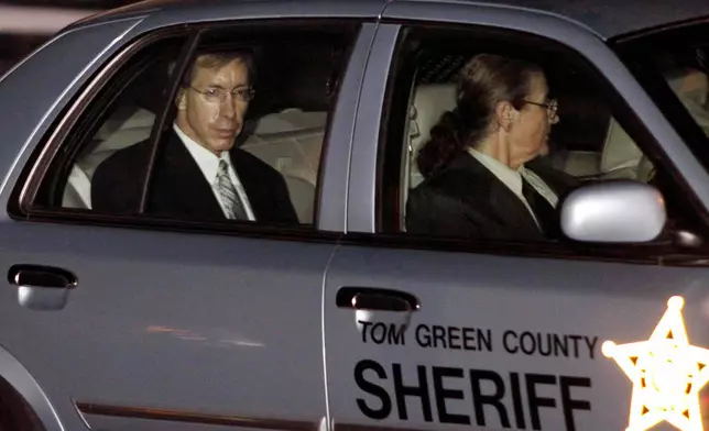 FILE - Polygamist leader Warren Jeffs, left, is driven away from the Tom Green County Courthouse by Sheriff's personnel Tuesday, Aug. 2, 2011, in San Angelo, Texas. (AP Photo/Tony Gutierrez, File)
