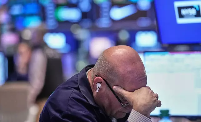 Trader Anthony Confusione works on the floor of the New York Stock Exchange, Thursday, Jan. 8, 2026. (AP Photo/Richard Drew)