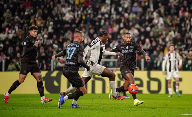 Juventus' Jonathan David, center, scores their side's first goal of the game during the Italian Serie A soccer match between Juventus and Napoli in Turin, Italy, Sunday, Jan. 25, 2026. (Marco Alpozzi/LaPresse via AP)