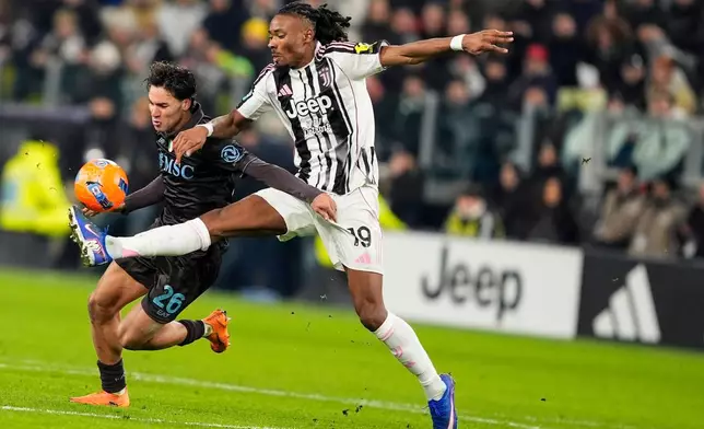 Juventus' Khephren Thuram, right, fights for the ball with Napoli's Antonio Vergara during the Italian Serie A soccer match between Juventus and Napoli in Turin, Italy, Sunday, Jan. 25, 2026. (Fabio Ferrari/LaPresse via AP)