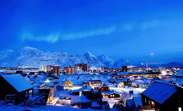 An Aurora Borealis is seen in the sky above Nuuk, Greenland, on Tuesday, Jan. 20, 2026. (AP Photo/Evgeniy Maloletka)