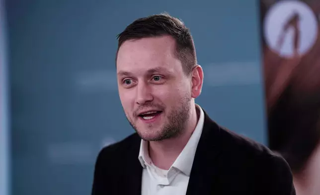 Greenlandic Prime Minister Jens-Frederik Nielsen speaks to journalists during press conference in Nuuk, Greenland, on Tuesday, Jan. 20, 2026. (AP Photo/Evgeniy Maloletka)