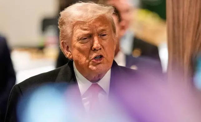 President Donald Trump talks to media after a meeting about Greenland during the Annual Meeting of the World Economic Forum in Davos, Switzerland, Wednesday, Jan. 21, 2026. (AP Photo/Markus Schreiber)