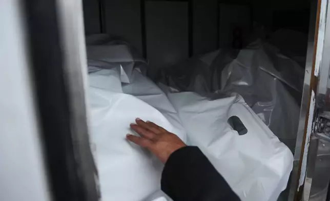 Bodies of Palestinians returned from Israel as part of the ceasefire deal are brought to Shifa Hospital, in Gaza City, Thursday, Jan. 29, 2026. (AP Photo/Abdel Kareem Hana)
