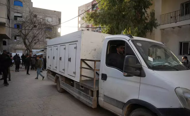 Red Cross vehicles transport bodies of Palestinians returned from Israel as part of the ceasefire deal to Shifa Hospital, in Gaza City, Thursday, Jan. 29, 2026. (AP Photo/Abdel Kareem Hana)