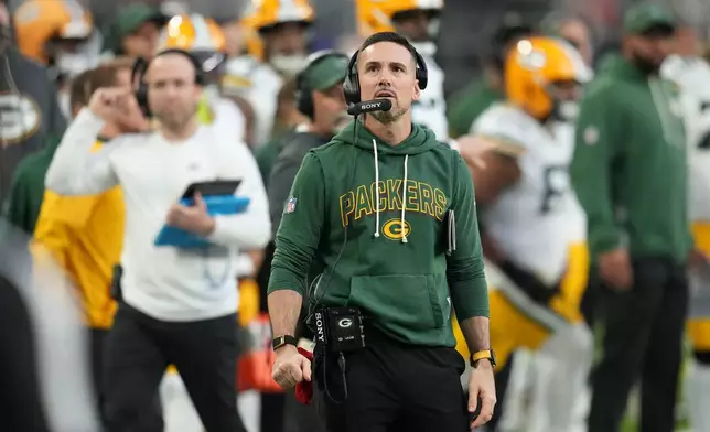 Green Bay Packers head coach Matt Lafleur watches from the sideline during the second half of an NFL football game against the Minnesota Vikings, Sunday, Jan. 4, 2026, in Minneapolis. (AP Photo/Ross D. Franklin)
