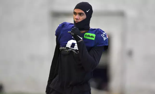 New England Patriots cornerback Christian Gonzalez warms up during an NFL football practice, Friday, Jan. 30, 2026, in Foxborough, Mass. (AP Photo/Steven Senne)