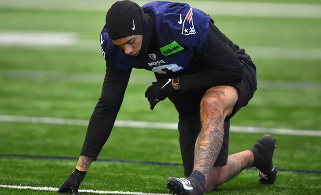 New England Patriots cornerback Christian Gonzalez warms up during an NFL football practice, Friday, Jan. 30, 2026, in Foxborough, Mass. (AP Photo/Steven Senne)