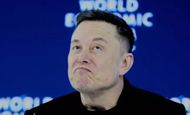 Elon Musk attends the Annual Meeting of the World Economic Forum in Davos, Switzerland, Thursday, Jan. 22, 2026. (AP Photo/Markus Schreiber)