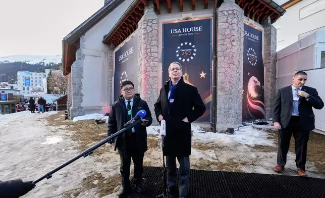 Scott Bessent, US Secretary of the Treasury, talks to media representatives at the USA House on the sidelines of the Annual Meeting of the World Economic Forum in Davos, Switzerland, Monday, Jan. 19, 2026. (AP Photo/Markus Schreiber)