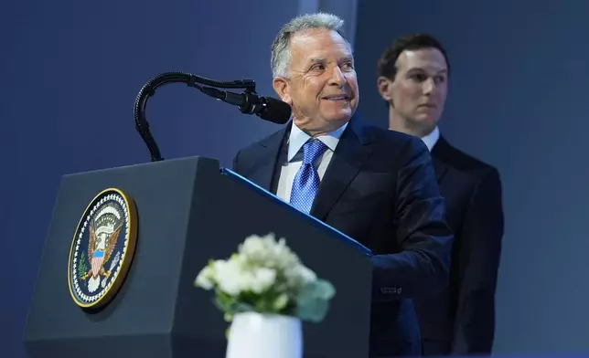 United States Mideast envoy Steve Witkoff, left, and Jared Kushner address the audience after the signing of a Board of Peace charter during the Annual Meeting of the World Economic Forum in Davos, Switzerland, Thursday, Jan. 22, 2026. (AP Photo/Evan Vucci)
