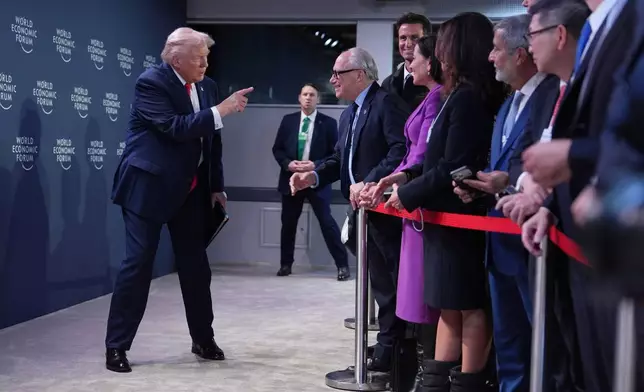 President Donald Trump arrives to address a meeting of Global Business Leaders at the Annual Meeting of the World Economic Forum in Davos, Switzerland, Wednesday, Jan. 21, 2026. (AP Photo/Evan Vucci)