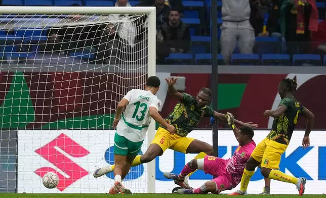 Senegal's Iliman Ndiaye scores the opening goal of his team during the Africa Cup of Nations quarterfinal soccer match between Senegal and Mali in Tangier, Morocco, Friday, Jan. 9, 2026. (AP Photo/Themba Hadebe)