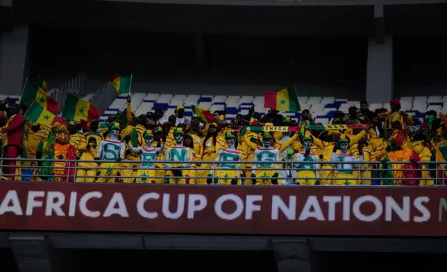 Senegal fans sing the national anthem ahead of the start of the Africa Cup of Nations quarterfinal soccer match between Senegal and Mali in Tangier, Morocco, Friday, Jan. 9, 2026. (AP Photo/Themba Hadebe)