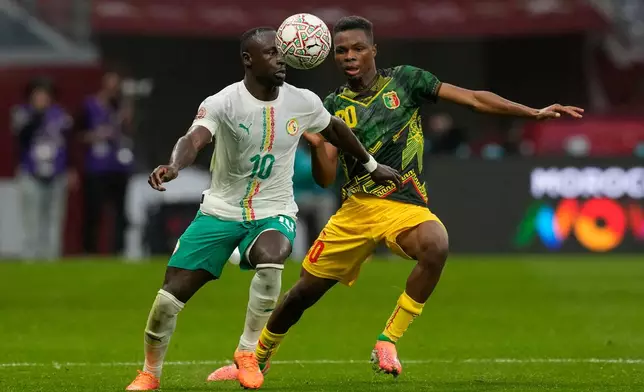 Senegal's Sadio Mane, left, and Mali's Mamadou Sangare fight for the ball during the Africa Cup of Nations quarterfinal soccer match between Senegal and Mali in Tangier, Morocco, Friday, Jan. 9, 2026. (AP Photo/Themba Hadebe)