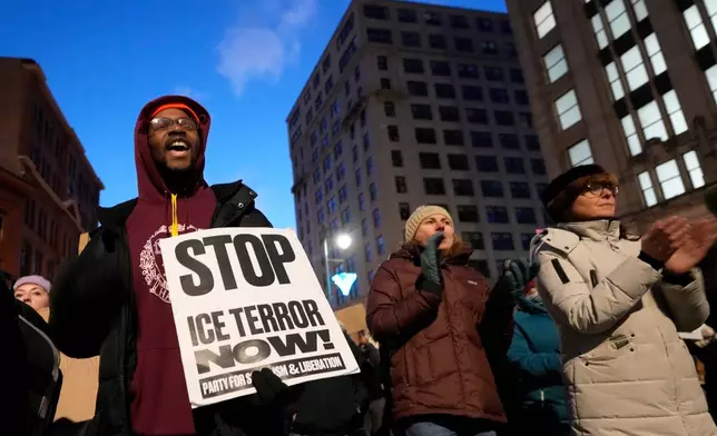 Protesters rally against the presence of U.S. Immigration Customs Enforcement in Maine, Friday, Jan. 23, 2026, in Portland, Maine. (AP Photo/Robert F. Bukaty)