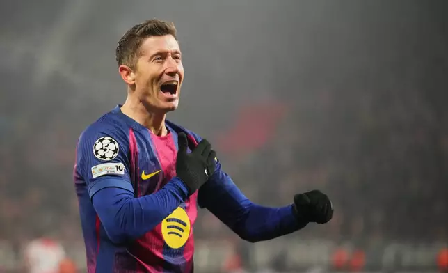 Barcelona's Robert Lewandowski celebrates after scoring his side's fourth goal during the Champions League opening phase soccer match between Slavia Prague and Barcelona in Prague, Czech Republic, Wednesday, Jan. 21, 2026. (AP Photo/Petr David Josek)