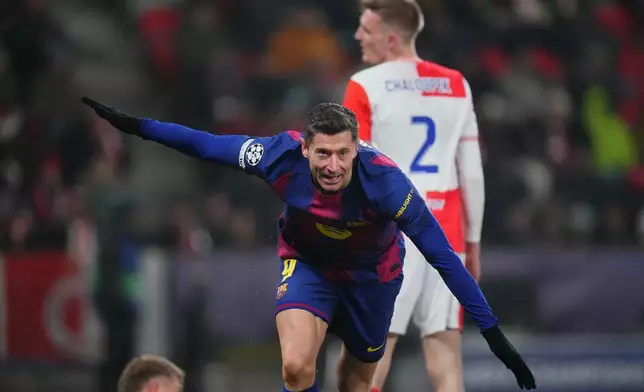 Barcelona's Robert Lewandowski celebrates after scoring his side's fourth goal during the Champions League opening phase soccer match between Slavia Prague and Barcelona in Prague, Czech Republic, Wednesday, Jan. 21, 2026. (AP Photo/Petr David Josek)
