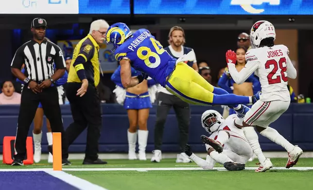 Los Angeles Rams tight end Colby Parkinson (84) dives into the end zone for a touchdown during the second half of an NFL football game against the Arizona Cardinals, Sunday, Jan. 4, 2026, in Inglewood, Calif. (AP Photo/Jessie Alcheh)