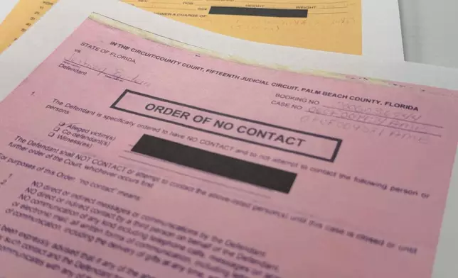 An email that was included in the U.S. Department of Justice release of the Jeffrey Epstein files is photographed Friday, Jan. 30, 2026, and shows a 2009 order of no contact in Palm Beach, Fla. (AP Photo/Jon Elswick)