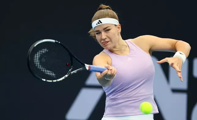 Karolína Muchova of the Czech Republic plays a shot during her semifinal tennis match against Aryna Sabalenka of Belarus at the Brisbane International in Brisbane, Australia, Saturday, Jan. 10, 2026. (AP Photo/Tertius Pickard)