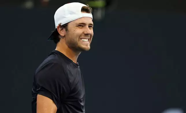 Aleksandar Kovacevic, of the United States, reacts after missing a shot during his semifinal match against his compatriot Brandon Nakashima at the Brisbane International tennis tournament in Brisbane, Australia, Saturday, Jan. 10, 2026. (AP Photo/Tertius Pickard)