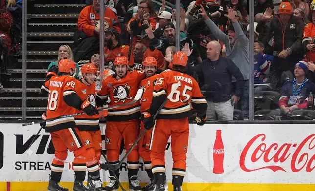 Anaheim Ducks left wing Alex Killorn, second from right, celebrates his goal with teammates during the second period of an NHL hockey game against the New York Rangers Monday, Jan. 19, 2026, in Anaheim, Calif. (AP Photo/Gregory Bull)