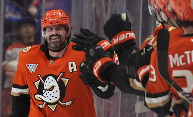 Anaheim Ducks left wing Alex Killorn celebrates his goal with teammates during the second period of an NHL hockey game against the New York Rangers Monday, Jan. 19, 2026, in Anaheim, Calif. (AP Photo/Gregory Bull)
