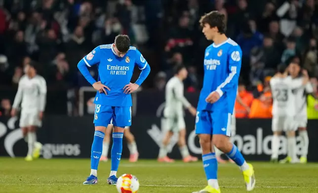 Real Madrid players react after Albacete scored its second goal during the Copa del Rey round-of-16 soccer match between Albacete and Real Madrid, in Albacete, Spain, Wednesday, Jan. 14, 2026. (AP Photo/Jose Breton)