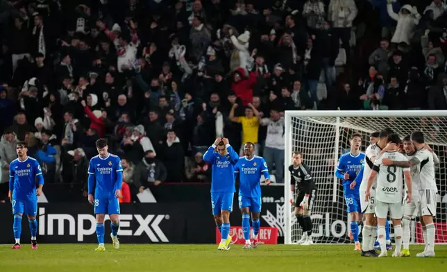 Real Madrid players react after Albacete scored its second goal during the Copa del Rey round of 16 soccer match between Albacete and Real Madrid, in Albacete, Spain, Wednesday, Jan. 14, 2026. (AP Photo/Jose Breton)